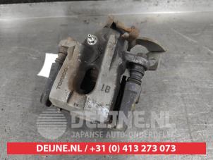Toyota Auris Bremszange links hinten O645179 foto 2