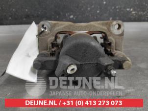 Suzuki Swift Front brake calliper, left O649279 photo 2