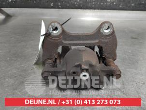 Daihatsu Sirion Front brake calliper, left O649393 photo 2