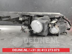 Toyota Avensis Headlight, left O650270 photo 2