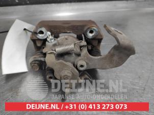 Toyota Yaris Rear brake calliper, left O650796 photo 2