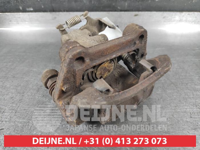 Hyundai IX20 Bremszange links hinten O650997