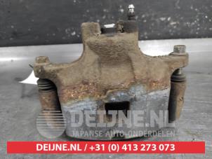 Mitsubishi Lancer Front brake calliper, left O652634 photo 3