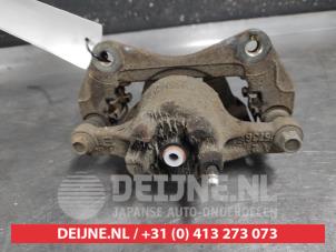 Mitsubishi Lancer Front brake calliper, left O652634 photo 2