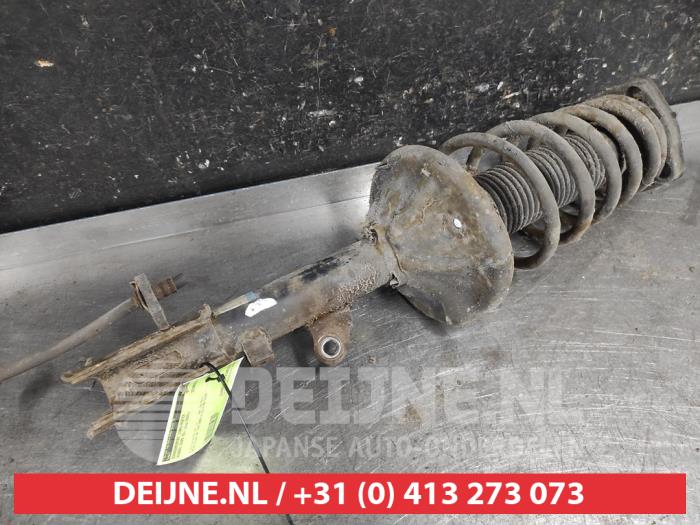 Hyundai Coupe Schokdemperpoot links-achter O656075