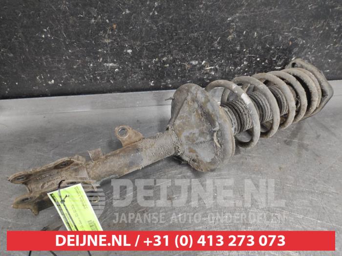Hyundai Coupe Schokdemperpoot rechts-achter O656076