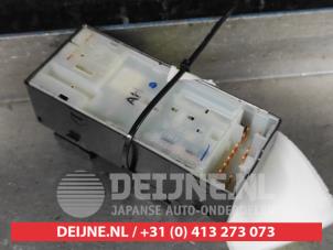 Nissan Micra Multi-functional window switch O657396 photo 2