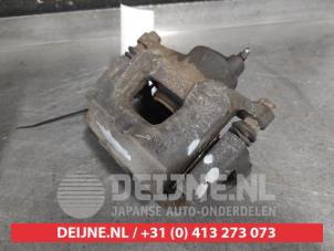 Toyota IQ Bremszange links vorne O657668 foto 2
