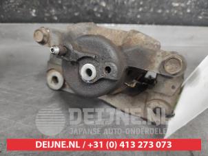 Toyota IQ Bremszange links vorne O657668 foto 3