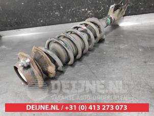Daihatsu Materia Front shock absorber rod, left O660132 photo 2