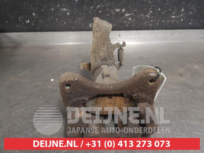 Nissan Almera Tino Remklauw (Tang) links-achter O663436