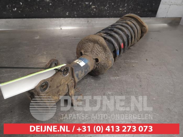 Mazda Demio Schokdemperpoot rechts-voor O663560
