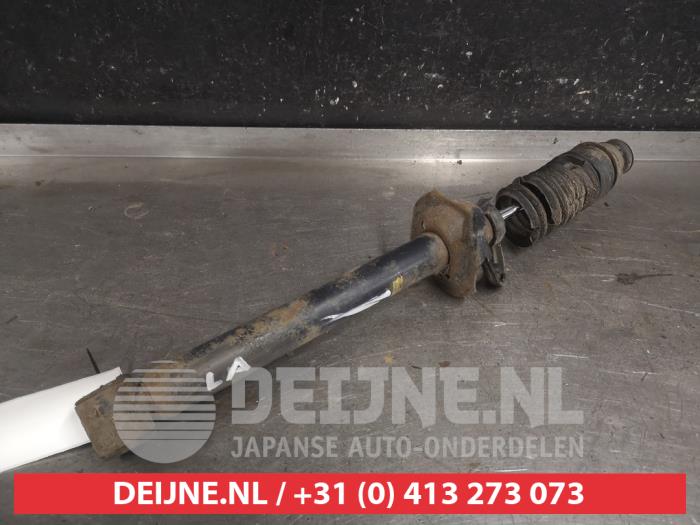 Mazda Demio Schokdemper links-achter O663561
