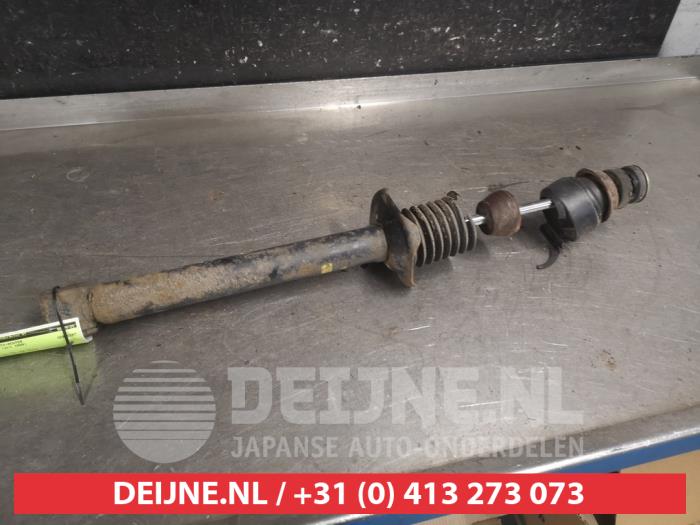 Mazda Demio Schokdemper rechts-achter O663589
