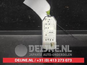 Toyota Verso-S Multi-functional window switch O665154 photo 2