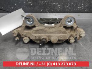 Toyota Hilux Front brake calliper, left O665581 photo 2