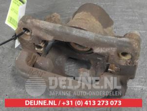 Nissan Qashqai Bremszange links hinten O668101 foto 2