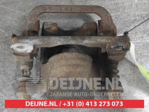 Nissan Qashqai Bremszange links hinten O668101 foto 3