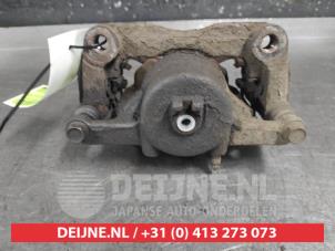 Nissan Qashqai Front brake calliper, left O668295 photo 2