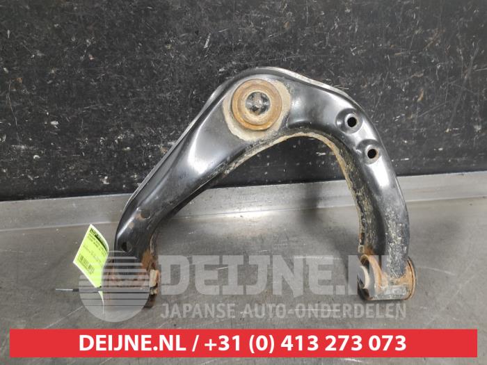 Nissan Navara Front upper wishbone, left O669154