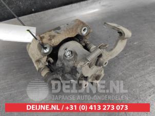 Toyota Verso-S Rear brake calliper, left O671291 photo 2