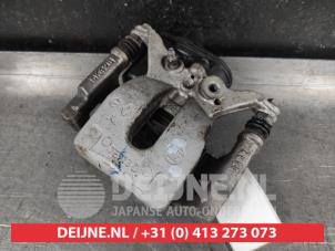 Nissan Qashqai Bremszange links hinten O673232 foto 2