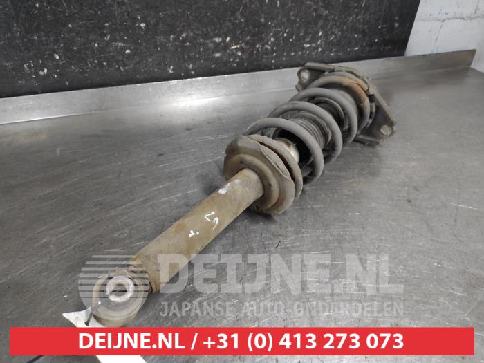 Nissan Almera Tino Schokdemperpoot links-achter O675863