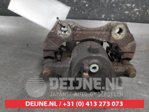 Nissan Almera Tino Front brake calliper, left O675866 photo 2