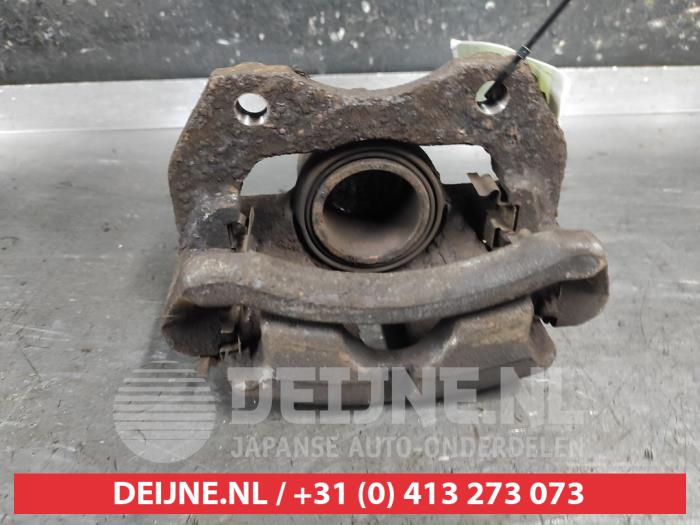 Nissan Almera Tino Remklauw (Tang) rechts-voor O675867