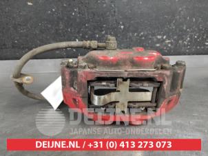 Subaru Impreza Bremszange links vorne O676138 foto 3