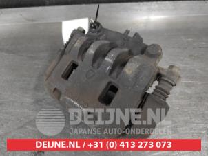 Subaru Legacy Bremszange links vorne O676291 foto 2