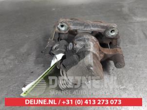 Mazda 5 Bremszange links hinten O681792 foto 2