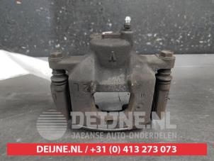 Toyota IQ Bremszange links vorne O687341 foto 3