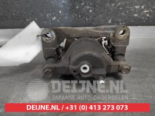 Toyota IQ Bremszange links vorne O687341 foto 2