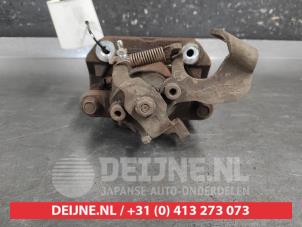 Toyota IQ Bremszange links hinten O687344 foto 2