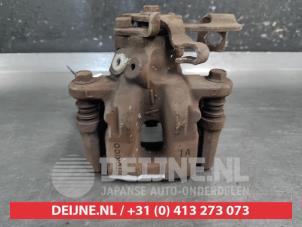 Toyota IQ Bremszange links hinten O687344 foto 3