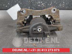 Toyota Avensis Front brake calliper, left O687357 photo 2