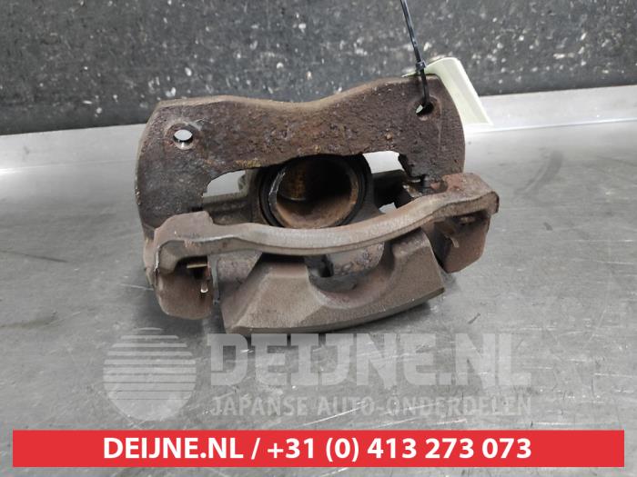 Toyota Prius Plus Bremszange links vorne O690998