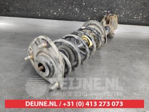 Mitsubishi Colt Schokdemperpoot links-voor O692599 foto 2