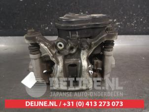 Toyota Yaris Rear brake calliper, left O696451 photo 3