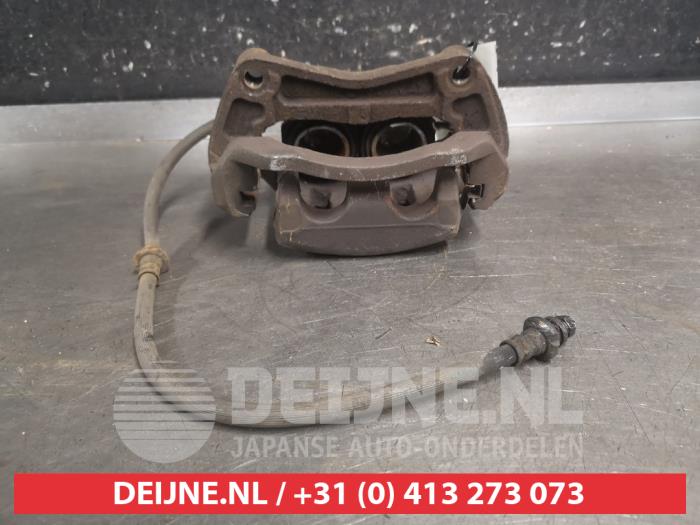 Nissan Qashqai+2 Bremszange links vorne O696470
