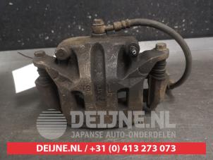Nissan Qashqai+2 Bremszange links vorne O696470 foto 3