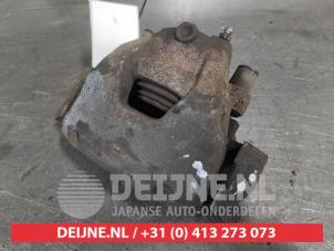Toyota Aygo X Front brake calliper, left O698742 photo 2