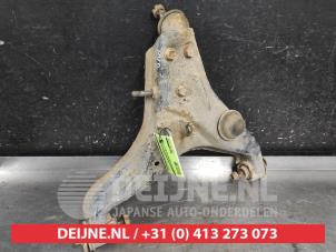 Mitsubishi L200 Front lower wishbone, right O699389 photo 2