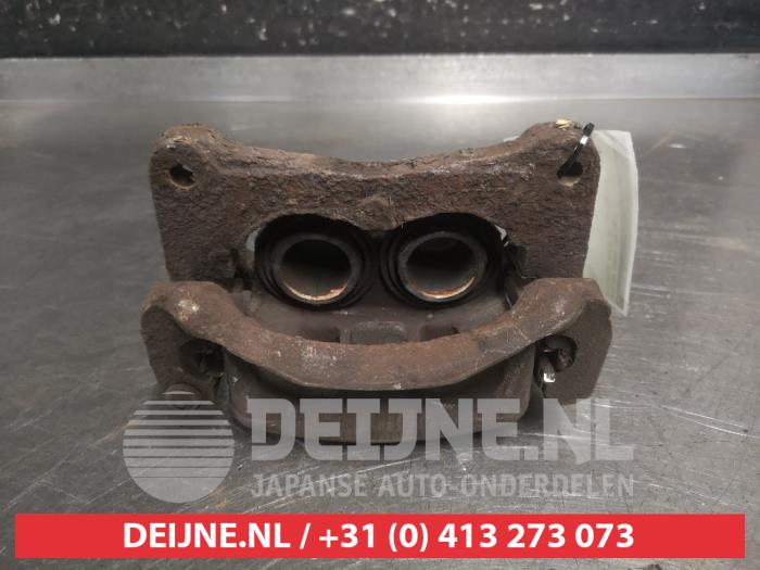 Mitsubishi Pajero Bremszange links vorne O700254