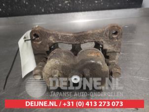 Mitsubishi Pajero Bremszange links vorne O700254 foto 2
