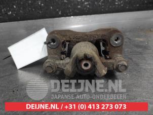 Kia Rio Remklauw (Tang) links-achter O701112 foto 2