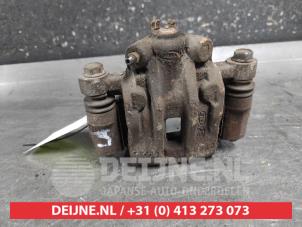 Kia Rio Remklauw (Tang) links-achter O701112 foto 3