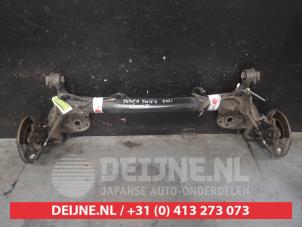 Gebruikte Achteras achterwielaandrijving Toyota Yaris IV (P21/PA1/PH1) 1.5 12V Hybrid 115 Prijs op aanvraag aangeboden door V.Deijne Jap.Auto-onderdelen BV