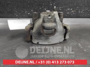 Toyota Yaris Front brake calliper, left O707542 photo 3
